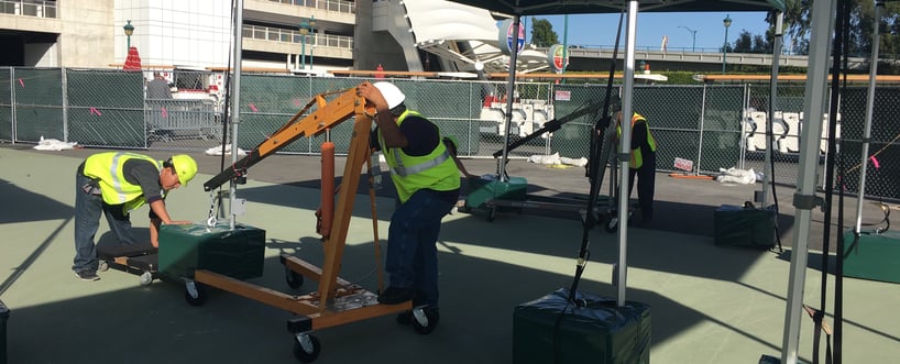 Promotional Design Group Installation team moving ballast in place